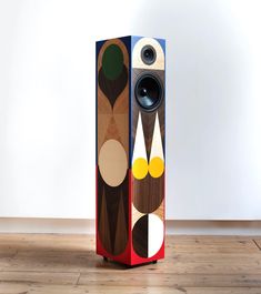 the speaker is designed to look like an abstract piece of art, and has two speakers on each side