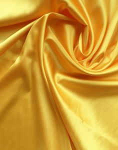 a close up view of a yellow fabric