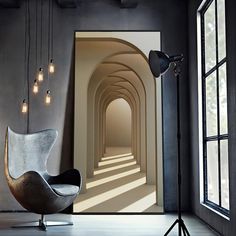 an empty room with light coming through the window and a chair in front of it