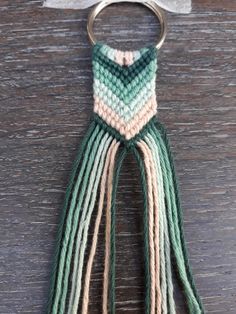 a keychain that has some tassels on it