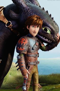 a young boy is standing next to a dragon