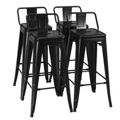 four black metal stools with backrests and barstools on an isolated white background