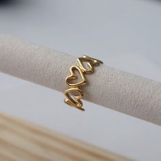 Crafted with a delicate open heart design and an adjustable fit, this ring will add a girly touch to any look. -stainless steel, gold plated Cherry Lady, Unique Diamond Wedding Rings, Mid Rings, Open Heart Ring, Preppy Jewelry, Gold Heart Ring, Jewelry Lookbook, Jewelry Design Necklace, Mini Heart