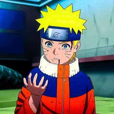 naruto in an orange and blue outfit with his fist raised while looking at the camera