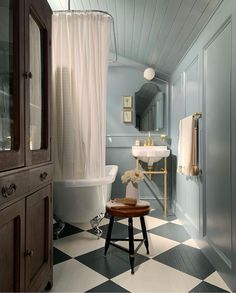 a bathroom with black and white checkered flooring