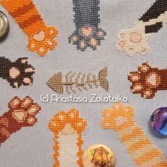 the cross stitch pattern has many different types of cats and dogs on it, including buttons