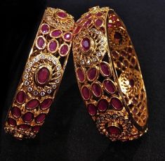 "2.4,2.6.2.8 Golden Ruby Bangles,Sabyasachi bangles,American Diamond Ruby Bangles,CZ Indian wedding jewelry,Cubic Zirconia Punjabi Bangles Traditional Bollywood rajwadi bangles set pair of 2 bangles with American diamond, ruby and semi precious Stones work. This bangles set is handcrafted with love and creativity and are perfect for any occasion may it be engagement, Wedding or any bridal ceremonies or social get-together. These handcrafted beautiful high quality bangles are made in brass alloy Cheap Red Bangle For Wedding, Luxury Ceremonial Bangle With Stone Work, Traditional Stone Work Bangle For Reception, Temple Jewelry Bangle For Reception And Festivals, Temple Jewelry Bangle For Festivals And Receptions, Temple Jewelry Bangle For Receptions And Festivals, Traditional Meenakari Bangle For Reception, Traditional Heavy Bangle For Reception, Kundan Jeweled Bangle For Wedding