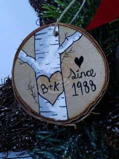 a wooden ornament with a tree and heart on it that says, birch since 1908