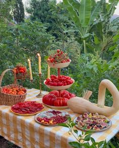 a table topped with lots of different types of fruits and veggies on it