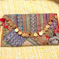 Indian Hand Embroidered Clutch Or Wallet On Chain. Perfect And Unique Holiday Gift. New And Comes With Cover, Red Interiors And Red Shoulder Chain, Two Zips On Inside And Fits Two Iphones Side To Side. It’s Bought From The Bazaars Of India And Each Piece Is Hand Made. Bohemian Embroidered Clutch For Festive Occasions, Multicolor Zari Work Pouch Shoulder Bag, Multicolor Embroidered Clutch For Festive Occasions, Festive Clutch Bags With Multicolor Embroidery, Red Embroidered Clutch For Festive Occasions, Gold Embroidered Festival Bag, Multicolor Embroidered Clutch For Festivals, Bohemian Clutch With Zari Work, Festive Multicolor Embroidered Clutch Bag