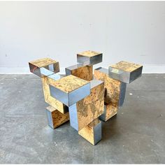 an abstract sculpture made out of metal blocks