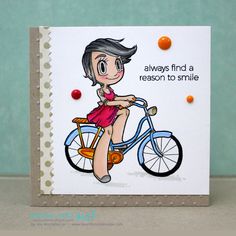 a handmade card with a girl on a bike and the words, always find a reason to smile