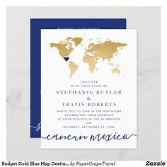 a blue and gold wedding card with the world map on it's back side