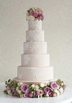 an image of a wedding cake with flowers on the top and bottom tiers that read, the independent