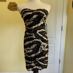 New With Tags Black And Silver Strapless Sequin Dress By As U Wish Purchased At Dillard’s Built In Light Padding At Bust Making Wearing A Bra Optional Stay Put Strip At Bust Line Fully Lined Fabric Provides Generous Stretch. Very Figure Flattering Beautiful Dress! Smoke Free, Pug Friendly Home Metallic Strapless Dress For Night Out, Strapless Sequin Dress For Holiday Party Season, Strapless Sequin Dress For Holiday Party, Silver Strapless Dress For Night Out, Silver Strapless Sequin Dress For Party Season, Metallic Strapless Dress For Party Season, Metallic Strapless Party Dress, Silver Strapless Dress For Party, Silver Strapless Sequin Dress For Night Out