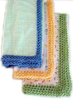 four crocheted cloths are lined up on top of each other