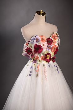 a white dress with flowers on it