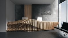 a wooden bench sitting in the middle of a room next to a wall with writing on it