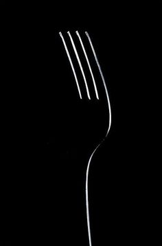 a fork that is sitting in the dark