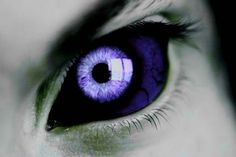 the iris of an eye is purple and black