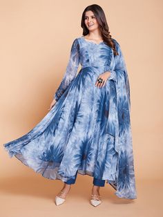 Step out in style with our vibrant blue anarkali suit. This stunning and vibrant ensemble is guaranteed to make a bold fashion statement. The combination of micro chiffon fabric for the salwar and faux georgette for the kameez and dupatta creates a beautiful blend of lightness and style. The outfit is digitally printed to provide superior detail and color, showcasing a breathtaking flower pattern that will capture everyone's attention.
The floral symphony anarkali suit is soaked in multiple shad Blue Georgette Anarkali Set With Long Sleeves, Blue Long-sleeve Anarkali Set, Blue Anarkali Set With Sheer Dupatta For Navratri, Blue Anarkali Maxi Set, Blue Anarkali Maxi Length Set, Blue Bollywood Anarkali Set With Long Sleeves, Blue Long Sleeve Bollywood Anarkali Set, Semi-stitched Blue Long Sleeve Anarkali Set, Blue Floor-length Anarkali Set