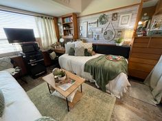 a living room filled with furniture and a flat screen tv