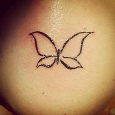 a woman's stomach with a butterfly tattoo on it