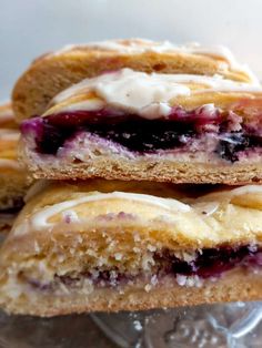 two blueberry filled pastries stacked on top of each other