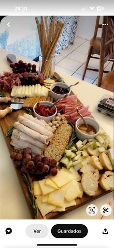 a table topped with lots of different types of cheese and crackers on top of it