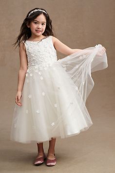 Dimensional floral appliques add a touch of whimsy to this tulle dress. The Princess Daliana Carrie Flower Girl Dress boasts textured floral embellishments, a front crew-neck, and a lower v-neck back. | Carrie Floral Applique Low-Back Tulle Flower Girl Dress by Princess Daliana in White, Women's, Size: 8, Polyester/Cotton/Tulle at Anthropologie Junior Bridesmaids Dresses, Floral Flower Girl Dresses, Toddler Wedding Dress, Flower Girl Dress White, Girls Dres, Tulle Flower Girl Dress, Princess Flower Girl Dresses, Toddler Flower Girl Dresses