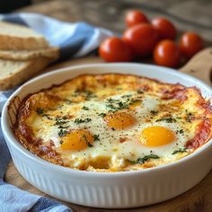 an egg and cheese casserole in a white dish on a wooden cutting board