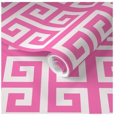 a pink and white wallpaper with greek design on it's side, in the middle