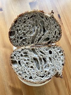 two slices of bread sitting on top of a white bowl