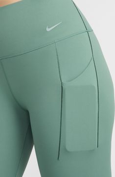 These everyday leggings boast signature InfinaSmooth tech that feels soft to the touch and are flexible enough for training, running or just lounging. 25" inseam; 8" leg opening; 11" front rise; 14" back rise (size Medium) Side drop-in pockets Lined gusset Dri-FIT moisture-wicking technology 76% nylon, 24% spandex Machine wash, tumble dry Imported Stretch Nike Yoga Pants, Nike Compression Activewear, Functional Nike Stretch Leggings, Nike Stretch Leggings For Functional Wear, Nike Functional Stretch Leggings, Nike Bottoms For Pilates, Nike Solid Bottoms For Pilates, Nike Compression Leggings For Yoga, Green Stretch Activewear With Comfort Waistband