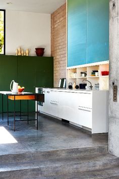 the kitchen is clean and ready to be used as a dining room or office space