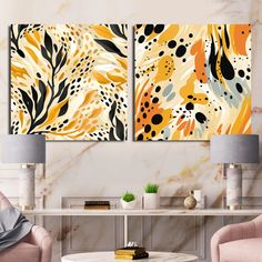 two paintings on the wall in a living room