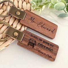 two personalized wooden luggage tags sitting on top of a basket