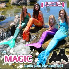 three mermaids are sitting on rocks in the water