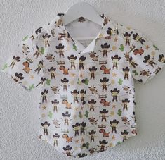 Adorable boys cotton shirt - made from 100% cotton with KAM snap buttons Available in sizes: - 2Y - 3Y - 4Y - 5Y - 6Y - 7Y - 8Y - 9Y - 10Y Wash on low. Line or tumble dry. Cotton Shirt For Summer Rodeo, Cotton Shirt For Rodeo In Summer, Tee Dress, Boy's Clothing, Cotton Shirt, Cowboy, Bathing Beauties, Tops & Tees, Top Outfits