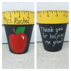 two pots with measuring tape and an apple painted on them, each one has a teacher's message