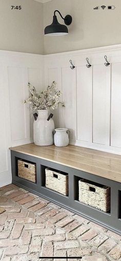 a bench with baskets on it in a room