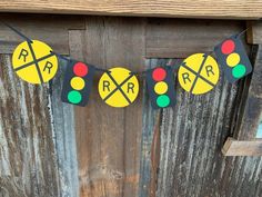 a railroad crossing sign is hanging from a wooden fence with the letters rr and rr painted on it