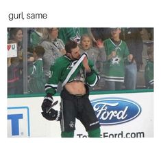 an image of a hockey player with no shirt on standing in front of the crowd