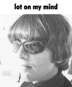 a black and white photo of a person wearing sunglasses with the words, lot on my mind