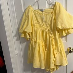 Super Cute From The Brand Trendy And Unique. Never Worn And Still Has Tags. Spring Mini Dress With Flowy Asymmetrical Hem, Flowy Mini Dress With Asymmetrical Hem For Spring, Chic Yellow Asymmetrical Dress For Spring, Yellow Asymmetrical Hem Dress For Spring, Spring Yellow Dress With Asymmetrical Hem, Asymmetrical Yellow Mini Dress For Spring, Spring Yellow Asymmetrical Mini Dress, Spring Vacation Mini Dress With Asymmetrical Hem, Spring Mini Dress With Asymmetrical Hem For Brunch