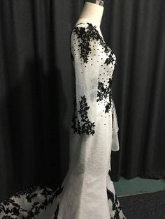 Any color combination for this style of formal dress would look awesome! Long Sleeve Black And White Formal Dresses, Black And Silver Fantasy Dress, Black And White Ballgown, Silver And Black Full Length Dress $1000, Black Andcwhit Gown Plus Size, White Evening Gowns, Fashion Website, Formal Dress, Color Combination