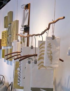 several towels hanging from hooks on a wall