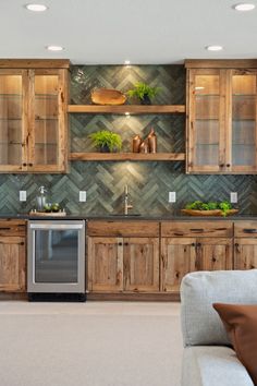 a kitchen with wooden cabinetry and stainless steel appliance in it's center