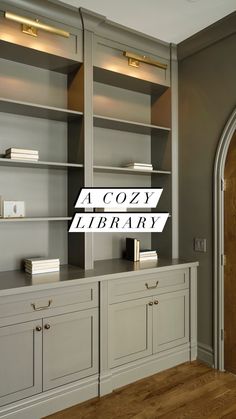 an empty library with wooden floors and gray walls, along with the words cozy library above it