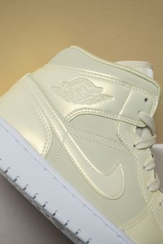 Thanks to its elegant finish, the Women’s Air Jordan 1 Mid “Lemon Yellow” is perfect for today’s sneaker collector who doesn’t mind meshing formal attire with sneakers, and vice versa. Air Jordan 1 Shoes, Jordan 1 Shoes, Air Jordan 1 Mid Se, Stadium Goods, Wallpaper Art, Nike Air Jordan 1, Air Jordan 1 Mid, Yellow Leather, Jordan 1 Mid